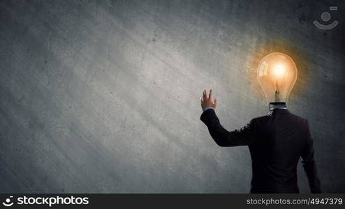 Having great idea in head. Idea concept with businessman and light bulb instead of his head