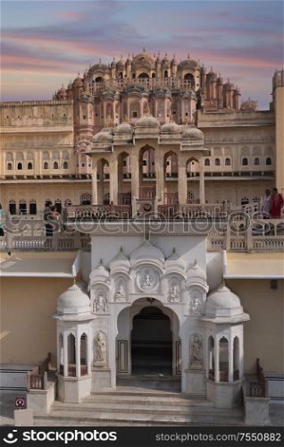 Hawa Mahal is a harem in the palace complex of the Jaipur Maharaja, built of pink sandstone in the form of the crown of Krishna