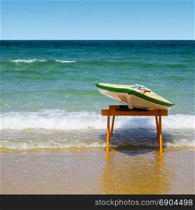 Hawaiian surfboard on the beach of the Mediterranean sea in Israel