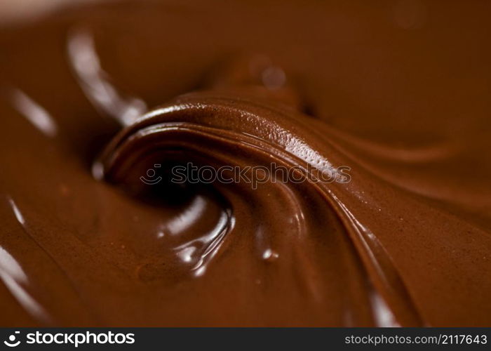 Hazelnut butter curl. Macro background. The texture of hazelnut butter . High quality photo. Hazelnut butter curl. Macro background.