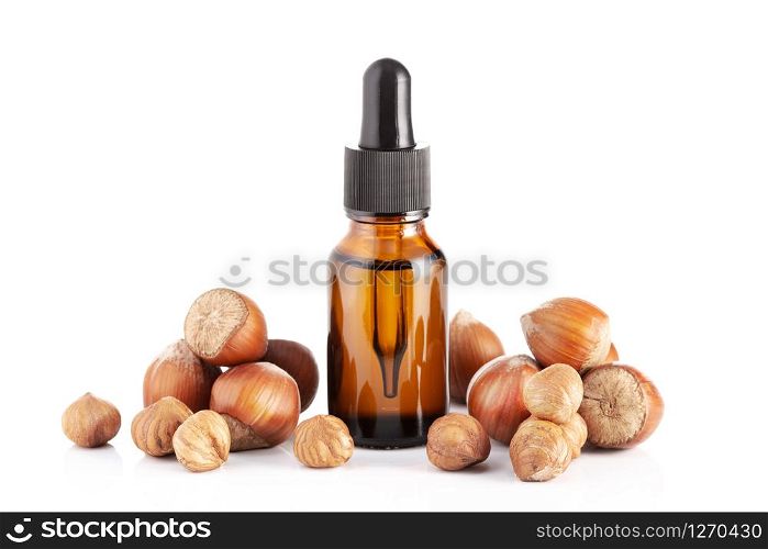 Hazelnut essential oil isolated on white background. Hazelnut oil for Cosmetic or beauty care