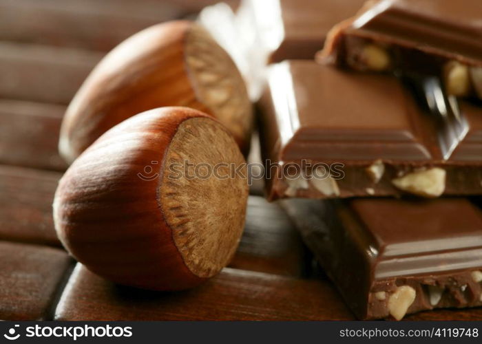 Hazelnuts and chocolate in brown enviroment