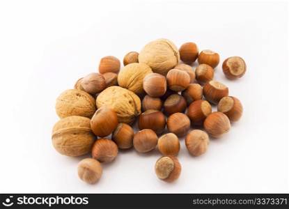 hazelnuts and walnuts isolated on white