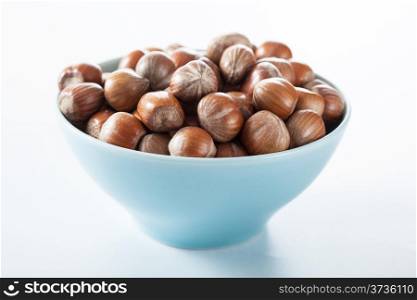 hazelnuts in blue bowl