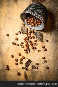 Hazelnuts in the old pot. On a wooden table.. Hazelnuts in the old pot.