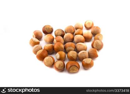 hazelnuts in the shape of a heart isolated on white