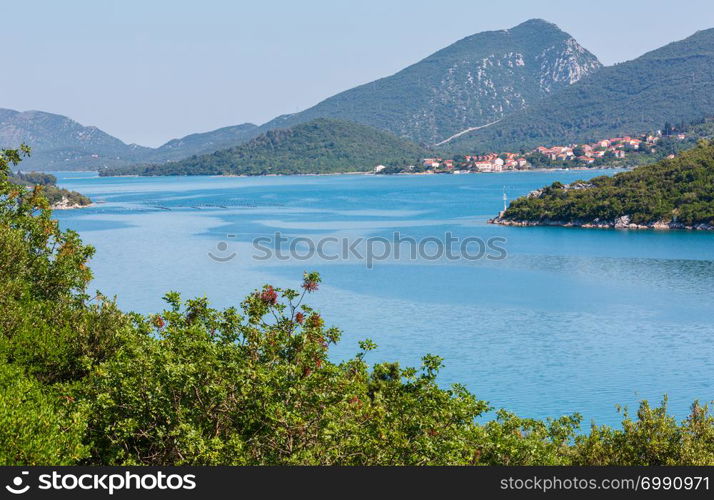 Hazy summer Adriatic sea with islands on horizon, Croatia.