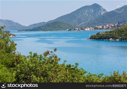 Hazy summer Adriatic sea with islands on horizon, Croatia.