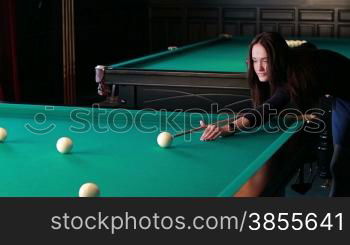 HD1080p: Beautiful Young Woman Playing Billiards.