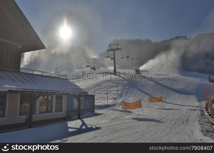 HDR photo of ski resort with lifts at snowy sunny day