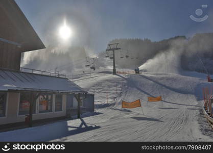 HDR photo of ski resort with lifts at snowy sunny day