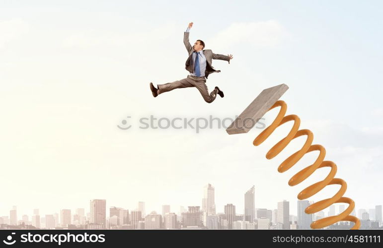 He did great career jump. Businessman jumping on springboard as progress concept