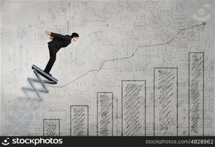 He did great career jump. Businessman jumping on springboard as progress concept