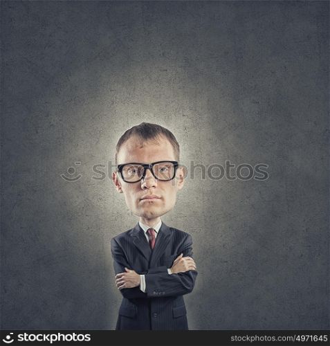 He has great mind. Young funny man in glasses with big head