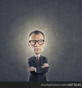 He has great mind. Young funny man in glasses with big head