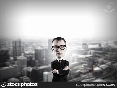 He has great mind. Young funny man in glasses with big head