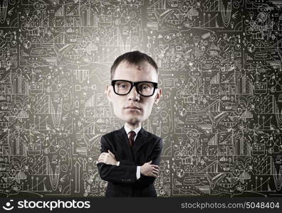 He has great mind. Young funny man in glasses with big head