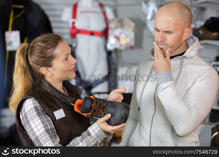 he is buying hiking shoes