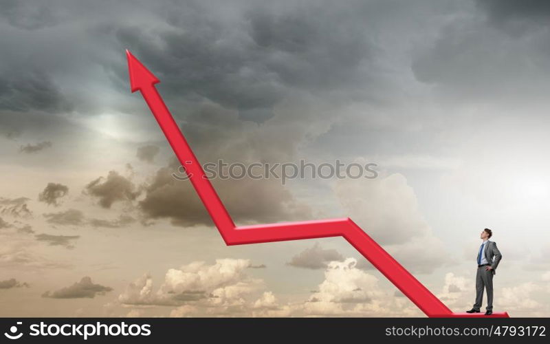 He is confident in his success. Confident businessman standing on red growing arrow graph