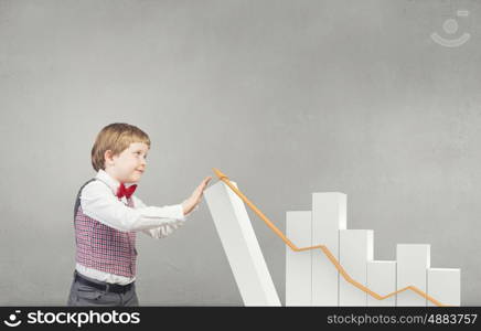 He is future businessman. Little boy businessman and growing bar graph