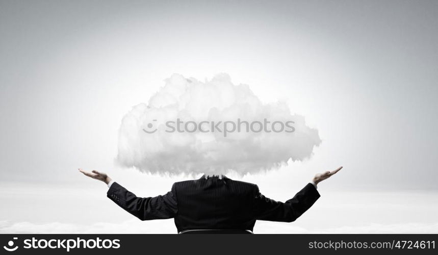 He is up in clouds. Young businessman with white cloud instead of head