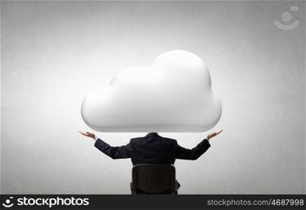 He is up in the clouds. Young businessman sitting in chair and cloud instead of head