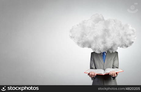 He is up in the clouds. Young businessman with book in hands and cloud instead of head