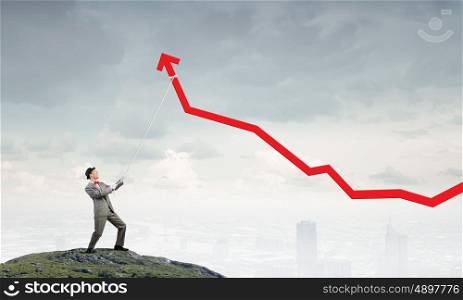 He makes it rise. Businessman pulling arrow with rope and making it raise up
