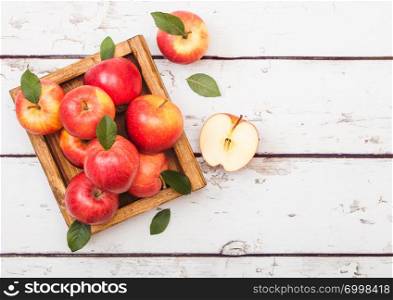 Hea;thy red organic healthy apples in vintage box on wood background.