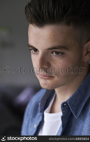 Head And Sholuders Portrait Of Serious Teenage Boy