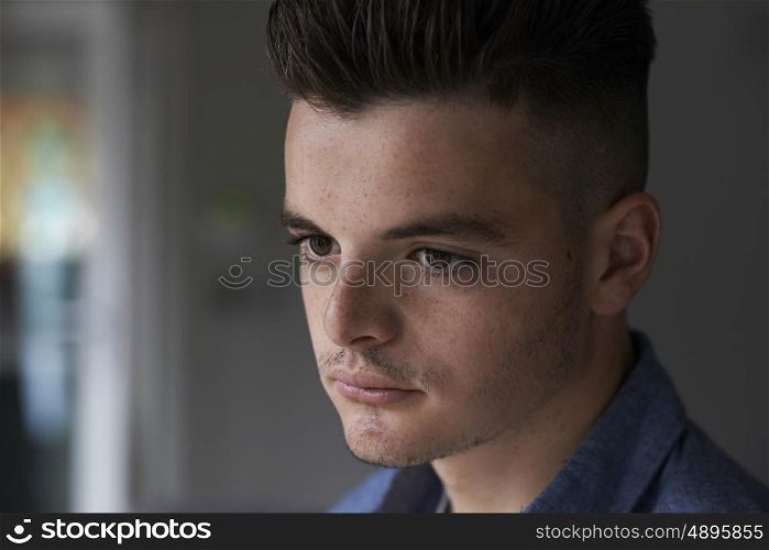Head And Sholuders Portrait Of Serious Teenage Boy
