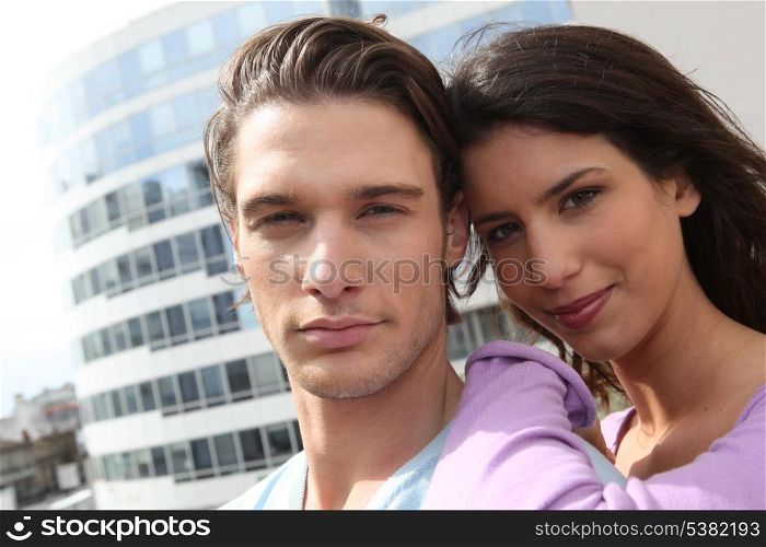 Head and shoulder of a young couple out in the city