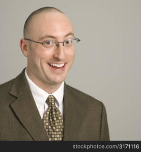 Head and shoulder portrait of smiling mid adult Caucasian businessman.