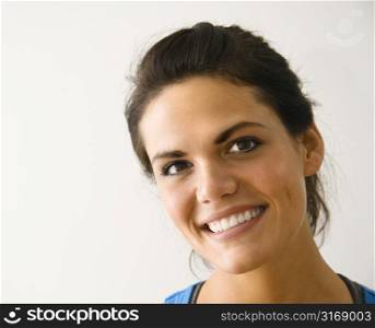 Head and shoulder portrait of woman smiling.