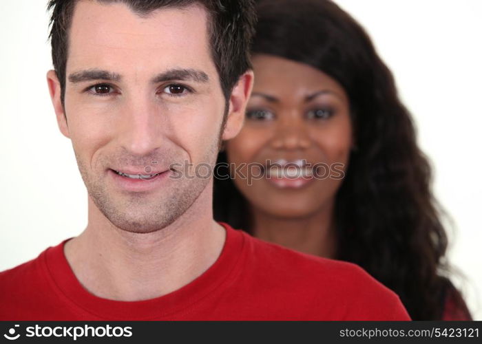 Head and shoulders of a happy couple shot in a studio