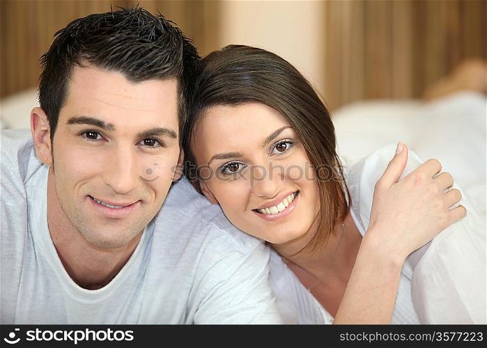 Head and shoulders of a relaxed young couple