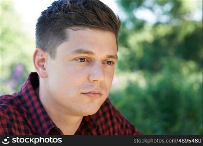Head And Shoulders Outdoor Portrait Of Concerned Man