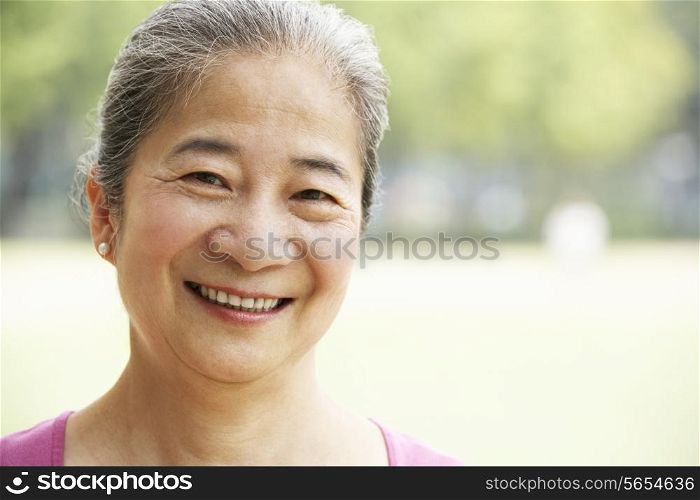 Head And Shoulders Portrait Of Attractive Chinese Senior Woman