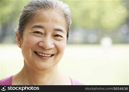 Head And Shoulders Portrait Of Attractive Chinese Senior Woman