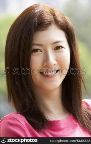 Head And Shoulders Portrait Of Attractive Chinese Woman