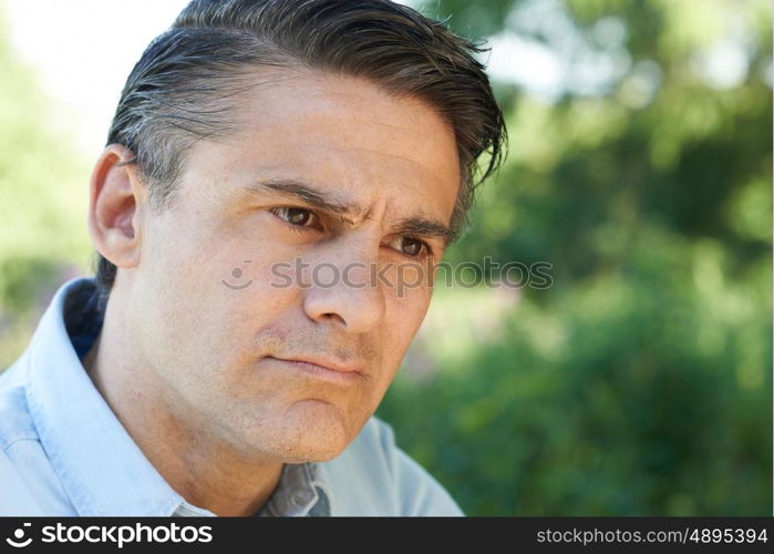 Head And Shoulders Portrait Of Concerned Mature Man