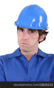 head-and-shoulders portrait of craftsman looking exasperated