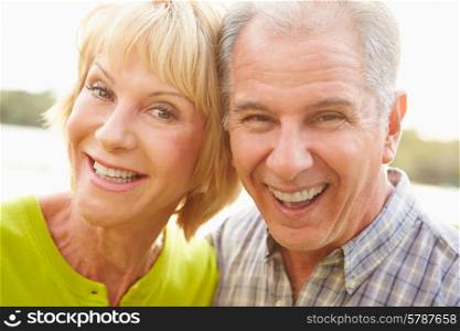 Head And Shoulders Portrait Of Senior Couple Outdoors
