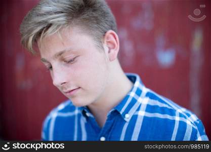Head And Shoulders Portrait Of Serious Teenage Boy