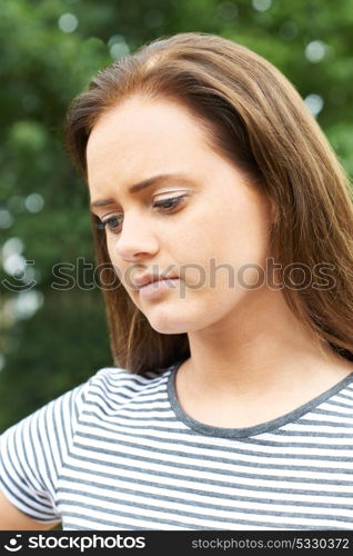 Head And Shoulders Portrait Of Serious Teenage Girl