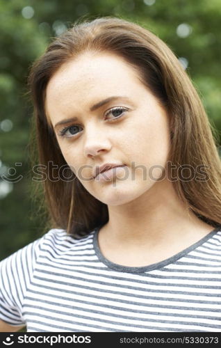 Head And Shoulders Portrait Of Serious Teenage Girl