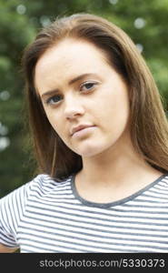 Head And Shoulders Portrait Of Serious Teenage Girl