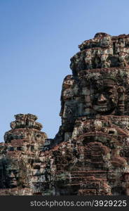 Head encarved in stone Bayon temple angkor. Head encarved in stone Bayon temple Angkor Wat Cambodia