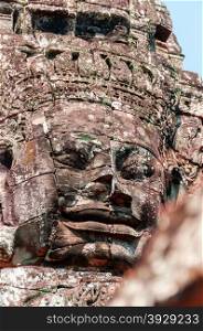 Head encarved in stone Bayon temple angkor. Head encarved in stone Bayon temple Angkor Wat Cambodia