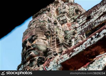 Head encarved in stone Bayon temple Angkor. Head encarved in stone Bayon temple Angkor Wat Cambodia